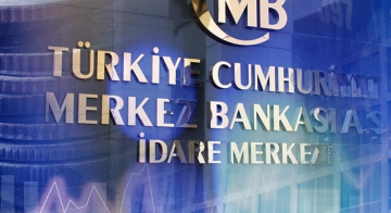 The façade of the Turkish Central Bank building with reflections of financial charts, symbolizing the growth in foreign currency and gold reserves. 01