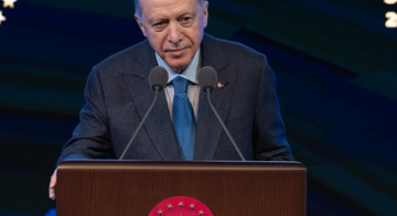 Turkish President Recep Tayyip Erdoğan delivering a speech at the launch of the National Employment Strategy in Ankara, emphasizing the importance of aligning economic policies with global developments to boost investment and exports in Turkey. 01